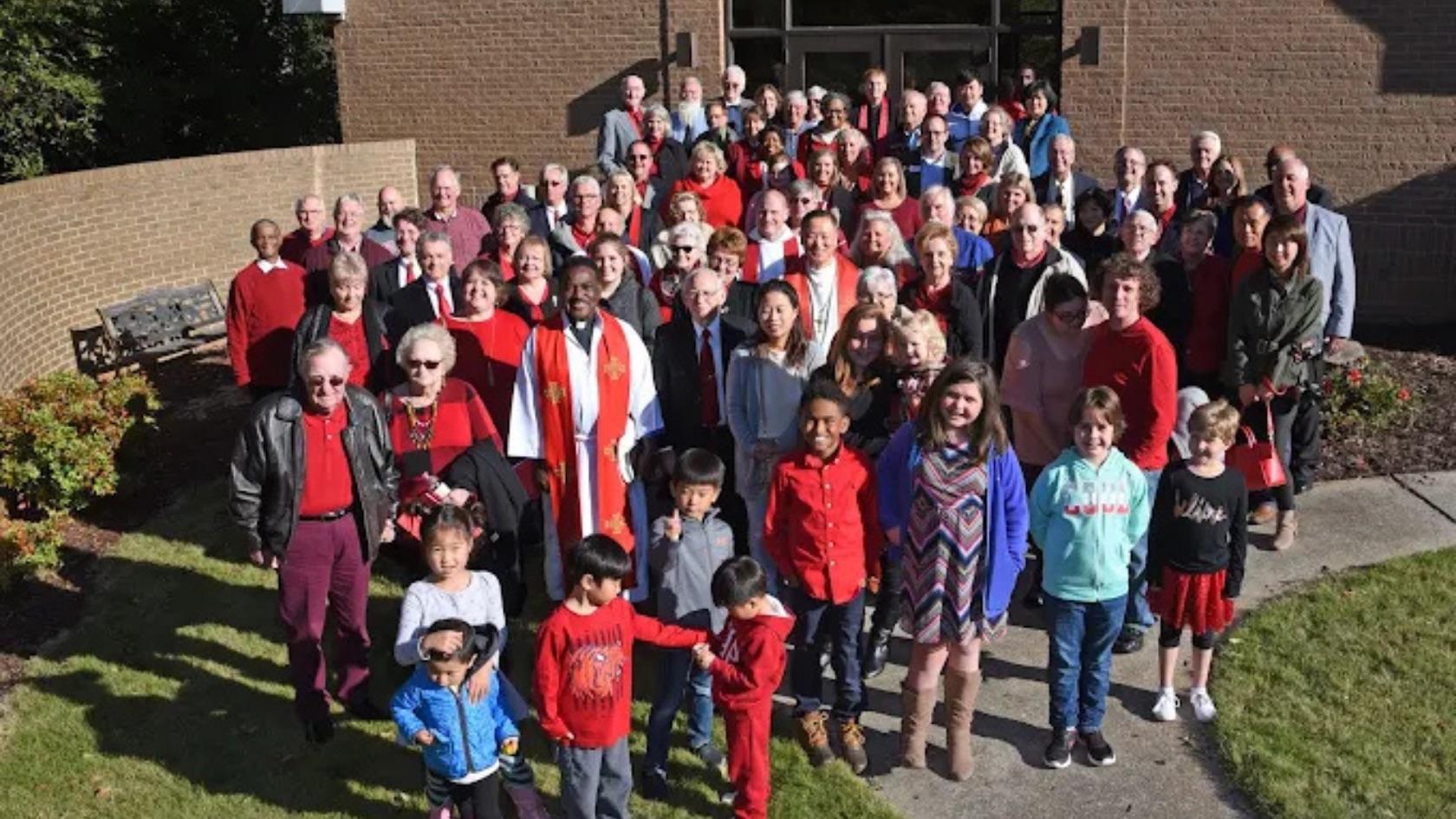 The Advent Lutheran congregation gathered outside the church